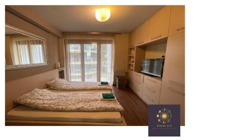 Posteľ alebo postele v izbe v ubytovaní Rising Sun Panorama Apartman I