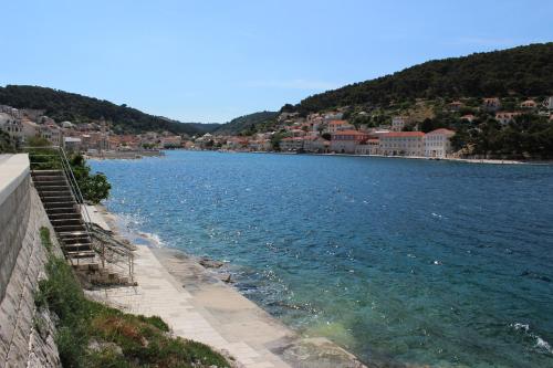 a view of a body of water next to a city at THE VIEW in Pučišća