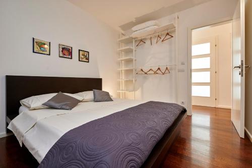 a bedroom with a large bed in a room at Apartments Gea Trogir in Trogir