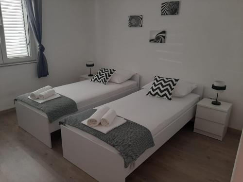 Postel nebo postele na pokoji v ubytování Apartman Alberta