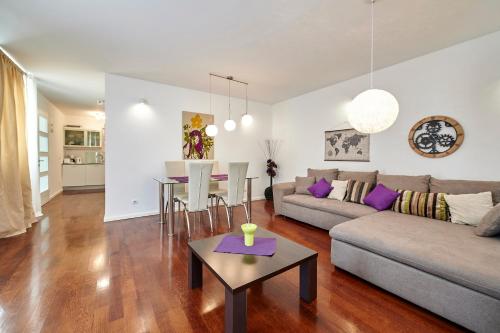 a living room with a couch and a table at Apartments Gea Trogir in Trogir