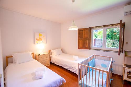 เตียงในห้องที่ Quinta de Carvalhal - Casa da Vinha