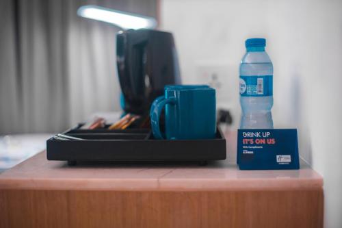 a bottle of water sitting on top of a table at Holiday Inn Express Manila Newport City by IHG in Manila