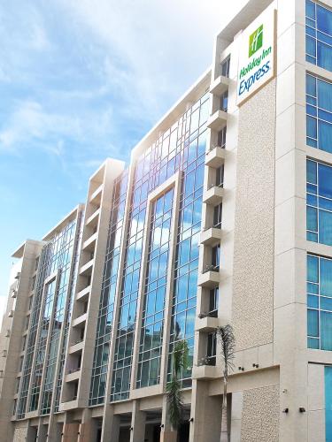 a building with a sign on the side of it at Holiday Inn Express Manila Newport City by IHG in Manila