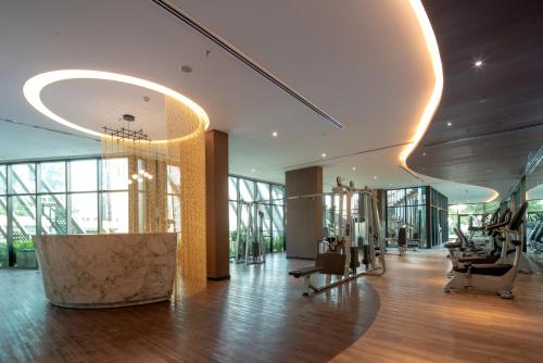 a lobby of a building with wooden floors and windows at Somerset Feliz Ho Chi Minh City in Ho Chi Minh City
