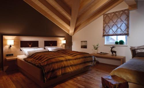 a bedroom with a large bed and a window at Apartments am alten Rathaus in Oberstdorf