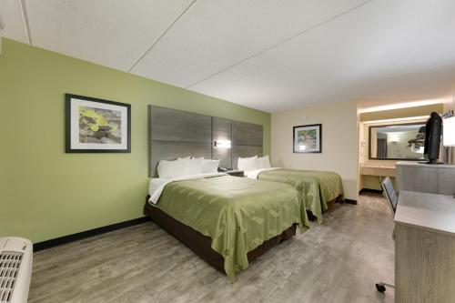 Cama o camas de una habitación en Quality Inn Airport - Southeast