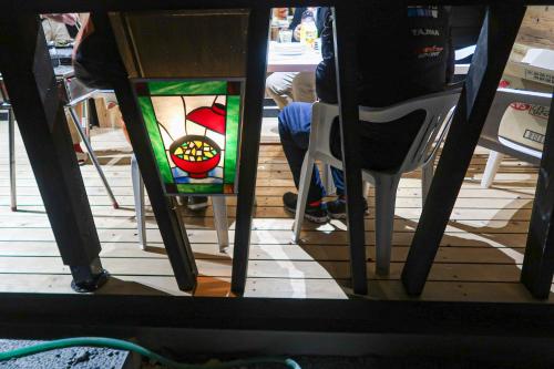 a view of a table with a stained glass window at B&B MIKAWA 5 - Villas with BBQ Terrace in Kanazawa