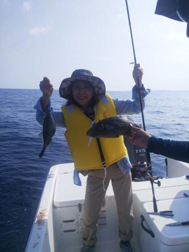 a woman holding a fish on a boat at B&B MIKAWA 5 - Villas with BBQ Terrace in Kanazawa