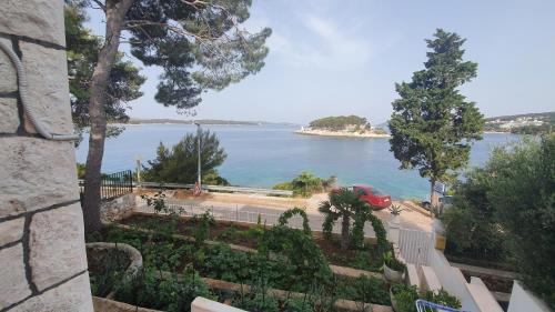 a view of a body of water from a building at Shabby chic beach cottage Hvar in Hvar
