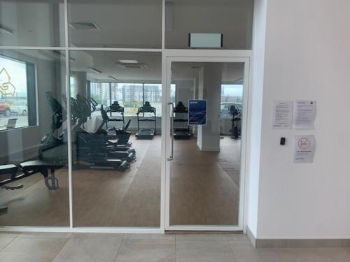 an empty gym with chairs and a glass door at Gillingham One in Gillingham
