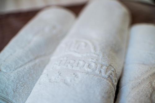 a close up of a white sock with a label on it at Hotel Fürdőház in Nyíregyháza