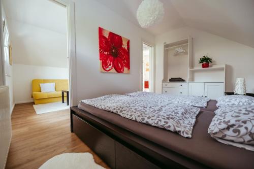 a bedroom with a large bed in a room at Apartment Oddih in Bled