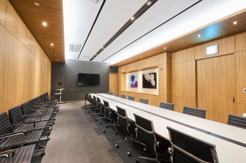 a conference room with a long table and chairs at Eden Paradise Hotel in Icheon