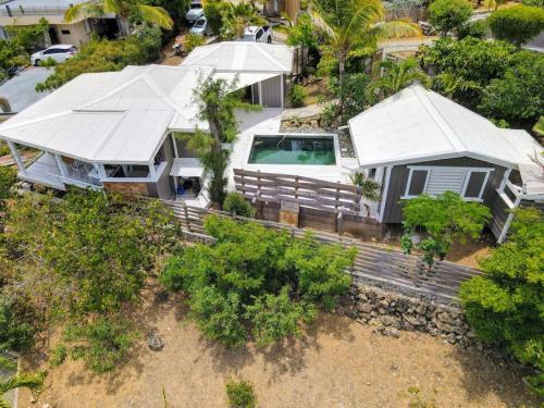 an overhead view of a house with a roof at Villa Cazou, sea view, private pool, Wifi 100Mbps in Oyster Pond
