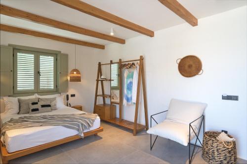 a bedroom with a bed and a chair at Carpe Diem Boutique Hotel - Adults Only in Side