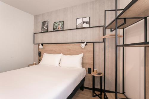 Postel nebo postele na pokoji v ubytování ibis Avignon Sud