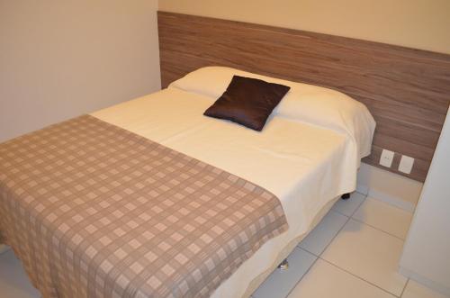 Ein Bett oder Betten in einem Zimmer der Unterkunft Apartamento Costa Azul