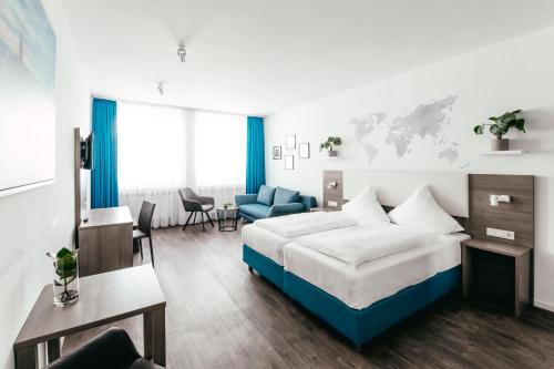 a bedroom with a bed and a living room at Haus am Dom - Apartments und Ferienwohnungen in Cologne