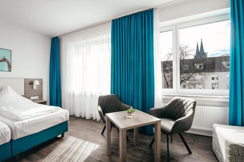 En eller flere senger på et rom på Haus am Dom - Apartments und Ferienwohnungen