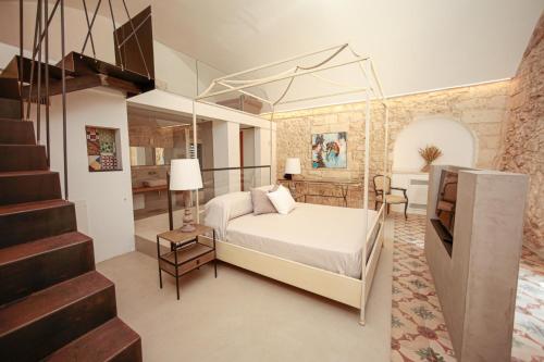A bed or beds in a room at Masseria Francescani