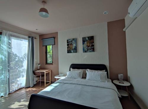 Postel nebo postele na pokoji v ubytování Morinaka Craftfe & Poshtel