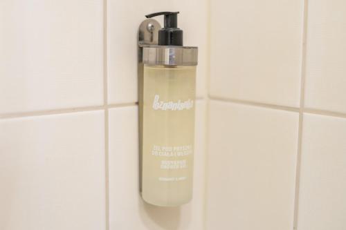 a water bottle is hanging on a wall at SeaPark Hotel Wellness & Spa in Kołobrzeg