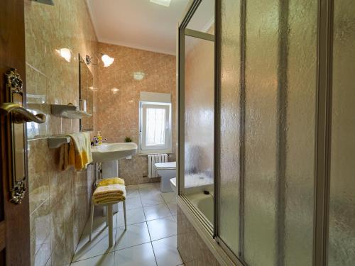 a bathroom with a shower and a sink at Finca Engracia in Cudillero