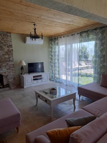 a living room with a couch and a coffee table at Diogenis Villa in Argostoli