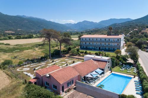 an aerial view of a building and a swimming pool at Hotel Arcu Di Sole in Propriano