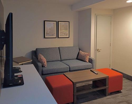 a living room with a couch and a table at Comfort Inn & Suites Wyomissing-Reading in Wyomissing