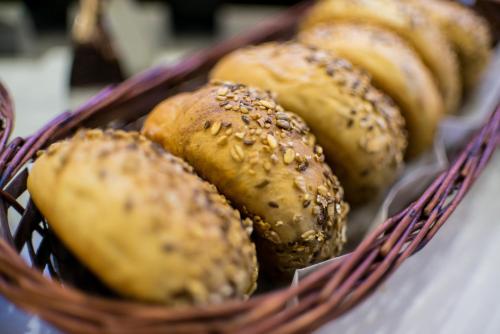 a basket of pastries sitting on a table at Hotel Fürdőház in Nyíregyháza