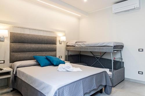 Postel nebo postele na pokoji v ubytování Versilia Residence - Colombo