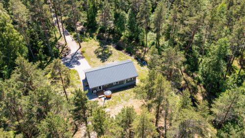 an aerial view of a house in the middle of a forest at Jõeranna Lodge in Paope