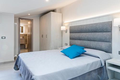 Postel nebo postele na pokoji v ubytování Versilia Residence - Colombo