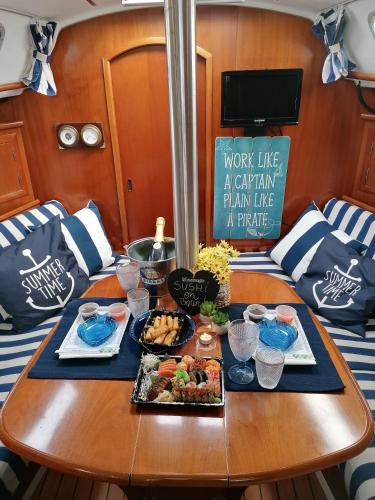 a table with plates of food on a boat at Douro Captain in Vila Nova de Gaia