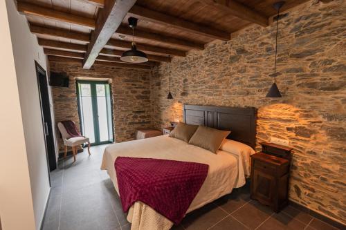 Postel nebo postele na pokoji v ubytování Apartamentos Rurales Casa Llongo