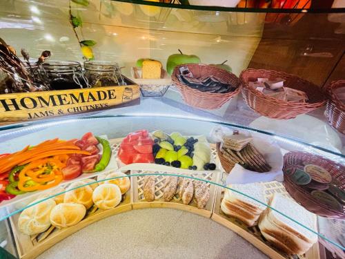 a refrigerator filled with lots of different types of food at Alpenpension Gasthof in Ratten