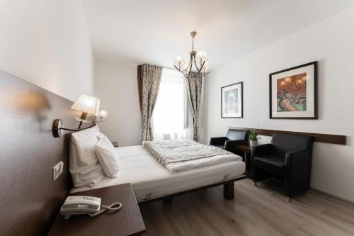 מיטה או מיטות בחדר ב-Hotel Antares
