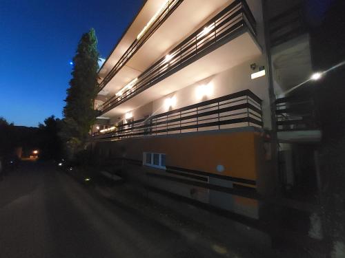 a building with lights on the side of it at night at Rezydencja Izabella in Wisła