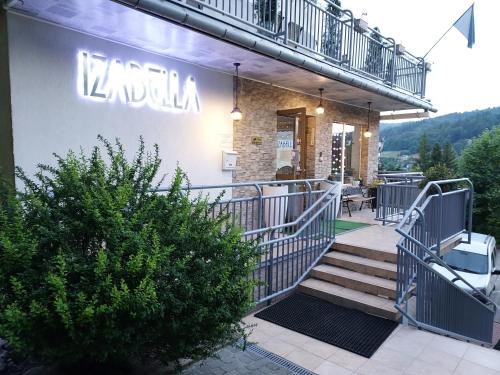 a building with stairs and a sign that reads koala at Rezydencja Izabella in Wisła