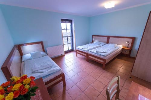Postel nebo postele na pokoji v ubytování Penzion Schwarzenberský seník