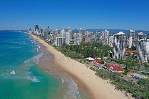 an aerial view of a beach and a city at De Ville Apartments in Gold Coast