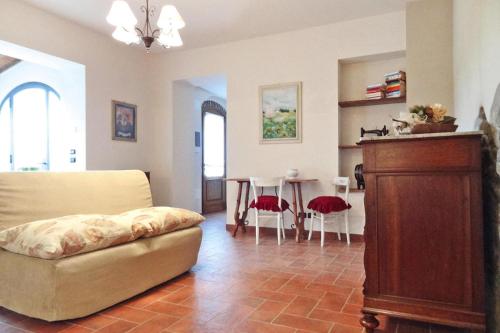 a living room with a couch and a table at Holiday home Cerbaiola Lamporecchio in Lamporecchio