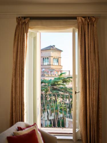 Ένα ή περισσότερα κρεβάτια σε δωμάτιο στο Hotel Eden - Dorchester Collection