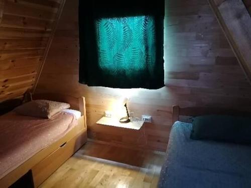 Uma cama ou camas num quarto em Zabljak_vikendica