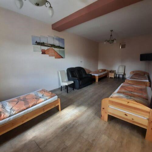 A bed or beds in a room at IKSZT Vendégház