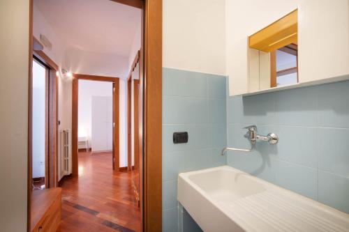 a bathroom with a white sink and a mirror at WePuglia - Casa sul Ponte in Polignano a Mare