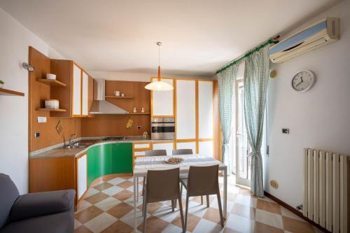 a kitchen and dining room with a table and chairs at WePuglia - Casa sul Ponte in Polignano a Mare