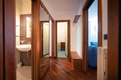 a bathroom with a sink and a mirror at WePuglia - Casa sul Ponte in Polignano a Mare